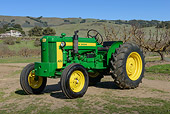 TRA 01 RK0285 01
1954 John Deere 420 Tractor Green And Yellow 3/4 Front View On Grass
