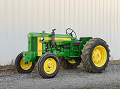 TRA 01 RK0286 01
1954 John Deere 420 Tractor Green And Yellow 3/4 Side View On Gravel
