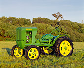 TRA 01 RK0006 02
John Deere Unstyled L Tractor 3/4 Front View On Grass  By Trees