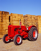 TRA 01 RK0051 01
1947 LA Case Red Tractor 3/4 Front View On Dirt By Hay Stacks