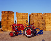 TRA 01 RK0060 02
1948 Farmall Cub Red Tractor 3/4 Rear View On Dirt By Bales Of Hay