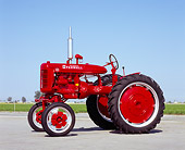 TRA 01 RK0069 07
1940's Farmall AV Red Tractor 3/4 Side View On Pavement Blue Sky