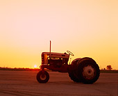 TRA 01 RK0075 01
1958 Ford 961 Red And Beige Tractor 3/4 Front View On Dirt Sunset