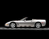 VET 01 RK0184 02
1998 Pewter Metallic Gray Chevy Corvette Convertible Profile On Checkerboard Lights On