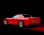 VET 01 RK0630 04
2004 Chevrolet Corvette Z06 Red 3/4 Rear View On Red Floor Gray Line Studio