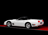 VET 01 RK0690 01
1994 Chevy Corvette Callaway Convertible White Rear 3/4 View On Red Floor Gray Line Studio