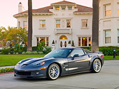 VET 01 RK0942 01
2010 Chevrolet Corvette ZR1 Gray 3/4 Front View On Pavement By Building
