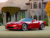 VET 01 RK0984 01
2011 Chevrolet Corvette GS Convertible Red 3/4 Front View On Brick By House