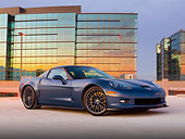 VET 01 RK0997 01
2011 Chevrolet Corvette Z06 Blue 3/4 Front View On Pavement By Building At Dusk