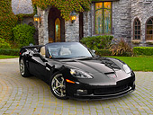 VET 01 RK1024 01
2011 Chevrolet Corvette GS Convertible Black 3/4 Front View On Brick By House