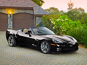 VET 01 RK1025 01
2011 Chevrolet Corvette GS Convertible Black 3/4 Front View On Brick By House