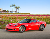 VET 01 RK1037 01
2012 Chevrolet Corvette Red 3/4 Side View On Pavement By Field Of Flowers