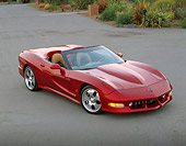 VET 01 RK1085 01
2002 Avelate Corvette Roadster Red 3/4 Front View On Pavement By Bushes