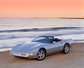 VET 01 RK0097 02
1996 Chevy Corvette Convertible Collector Edition Silver 3/4 Front On Beach By Water At Dusk