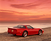 VET 01 RK0336 07
1990 Chevrolet Corvette Shinoda Red Rear 3/4 View On Sand