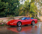 VET 01 RK0340 07
1990 Chevrolet Corvette Shinoda Red On Wet Pavement By Trees