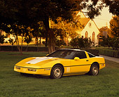VET 01 RK0488 03
1986 Chevrolet Corvette Yellow 3/4 Front View On Grass