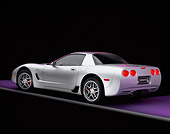 VET 01 RK0511 01
2001 Chevrolet Corvette Z06 Silver 3/4 Rear View On Purple Floor Gray Line Studio