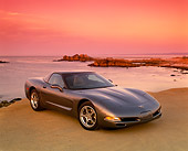 VET 01 RK0575 06
2003 Chevrolet Corvette Coupe Gray 3/4 Front View On Sand By Ocean Filtered