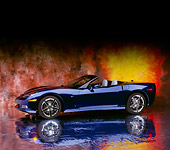 VET 01 RK0698 08
2005 Chevrolet Corvette C6 Convertible Blue 3/4 Side View On Mylar Floor Sunburst Background