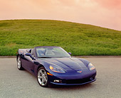 VET 01 RK0702 04
2005 Chevrolet Corvette C6 Convertible Blue 3/4 Front View On Pavement By Grass Hills Filtered