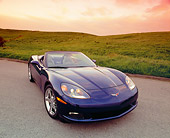 VET 01 RK0705 03
2005 Chevrolet Corvette C6 Convertible Blue Wide Angle Front 3/4 View On Pavement By Grass Hills Filtered