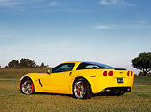 VET 01 RK0727 02
2006 Chevrolet Corvette Z06 Yellow Low 3/4 Rear View On Grass