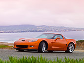 VET 01 RK0845 01
2008 Chevrolet Corvette Z06 Orange 3/4 Front View On Road By Water