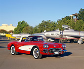 VET 02 RK0248 02
1959 Chevrolet Corvette Convertible Red And White Front 3/4 View On Pavement By Military Airplanes