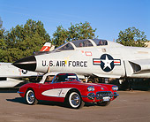 VET 02 RK0250 02
1959 Chevrolet Corvette Convertible Red And White 3/4 Front View On Pavement By Military Airplanes