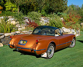 VET 02 RK0260 02
1955 Chevrolet Corvette Bubble Top Copper 3/4 Rear View On Grass By Bushes And Trees