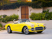 VET 02 RK0348 01
1959 Chevrolet Corvette Convertible Yellow 3/4 Front View On Pavement By Building