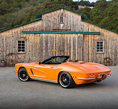 VET 03 RK0704 01
1962 Chevrolet Corvette Convertible Orange 3/4 Rear View On Pavement By Old Barn