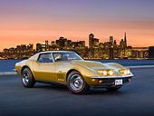 VET 03 RK0729 01
1969 Chevrolet Corvette L88 Gold 3/4 Front View On Pavement By City Skyline At Sunset