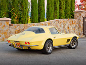 VET 03 RK0769 01
1967 Chevrolet Corvette Yellow 3/4 Rear View On Pavement By Stone Wall And Trees