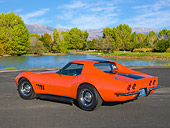VET 03 RK0780 01
1968 Chevrolet Corvette Orange With Black Stripe 3/4 Rear View On Pavement By Pond And Trees