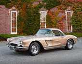 VET 03 RK0802 01
1962 Chevrolet Corvette Sand Pearl 3/4 Front View On Pavement By Brick Building