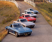 VET 03 RK0072 04
1963-1967 Chevrolet Corvettes Parked All In A Row 3/4 Side View On Pavement