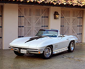 VET 03 RK0078 10
1967 Chevrolet Corvette 427 Convertible White And Black Front 3/4 View By Garage