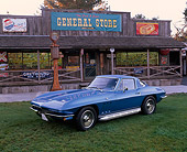 VET 03 RK0190 03
1965 Chevrolet Corvette 327 Blue 3/4 Side View On Grass By Store