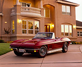 VET 03 RK0192 03
1967 Chevrolet Corvette 327 Convertible Burgundy 3/4 Front View On Driveway By House Filtered
