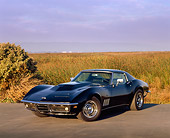 VET 03 RK0204 01
1969 Chevrolet Corvette Stingray Black 3/4 Front View On Pavement By Tall Grass