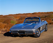 VET 03 RK0332 07
1965 Chevrolet Corvette 396 Convertible Silver 3/4 Front View On Dirt Dry Bushes Blue Sky