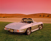 VET 03 RK0333 03
1965 Chevrolet Corvette 396 Convertible Silver 3/4 Rear View On Grass Red Filter