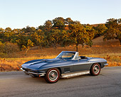 VET 03 RK0365 02
1967 Chevrolet Corvette Stingray Convertible Blue 3/4 Side View On Pavement By Trees