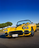 VET 03 RK0369 04
1962 Chevrolet Corvette Convertible Extreme Yellow Low 3/4 Front View On Pavement Trees Blue Sky