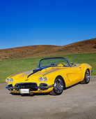VET 03 RK0373 01
1962 Extreme Chevrolet Corvette Convertible Yellow 3/4 Front View On Pavement By Grass Blue Sky