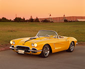 VET 03 RK0377 11
1962 Chevrolet Corvette Extreme Convertible Yellow 3/4 Front View On Pavement By Grass Filtered