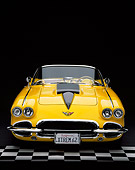 VET 03 RK0386 04
1962 Extreme Chevrolet Corvette Convertible Yellow Head On Shot On Checkered Floor Studio