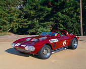 VET 03 RK0389 04
1963 Chevrolet Corvette Grand Sport Replica Red 3/4 Front View On Sand By Trees